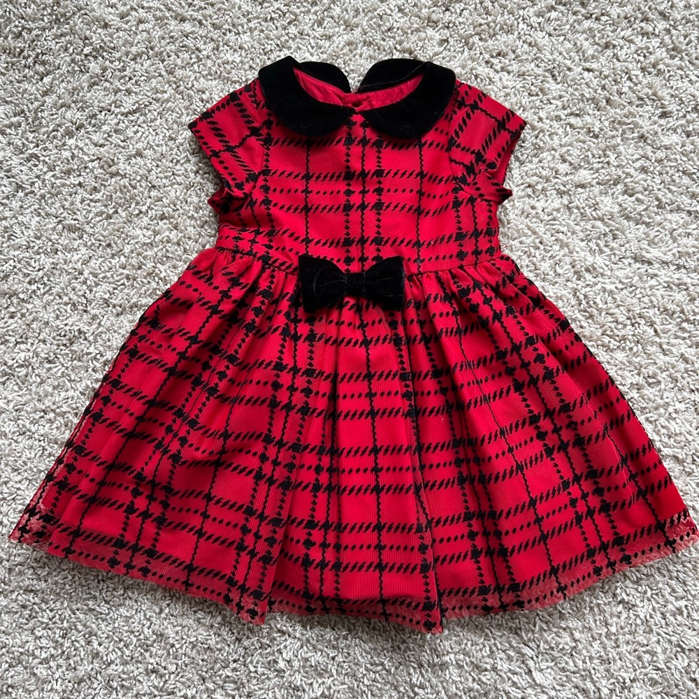 Red and black formal dress with Peter Pan collar .